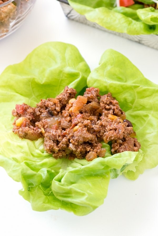 A lettuce wrap filled with ground beef.
