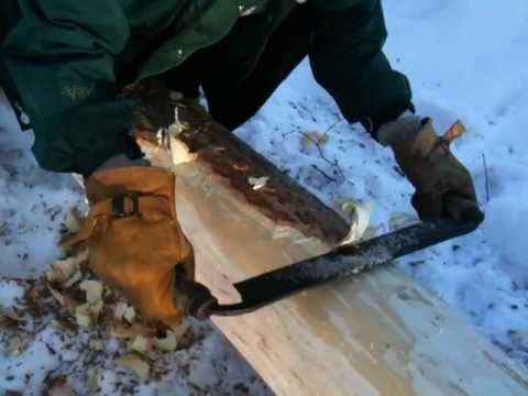 Log Cabin Building, peeling logs in winter