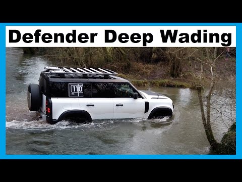 We drive our Land Rover Defender 2020 Through A Deep...