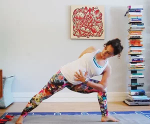 Andrea Ferretti in a yoga pose