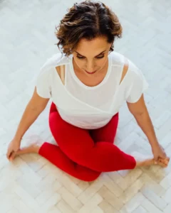 Andrea Ferretti in a yoga pose, photographed from above