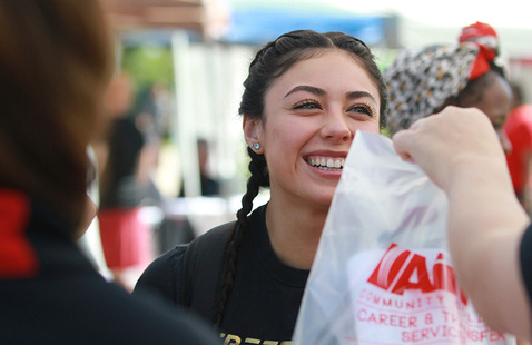 A smiling Aims Community College student