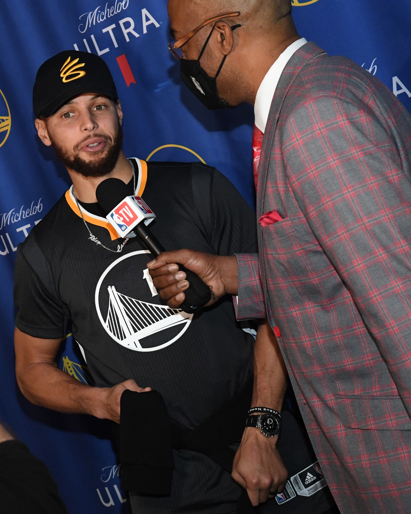 TNT Sideline Reporter Dennis Scott interviews Stephen Curry 30 of the Golden State Warriors before the game against the...
