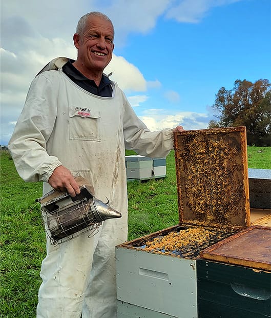 Bruce Lowe servicing hives