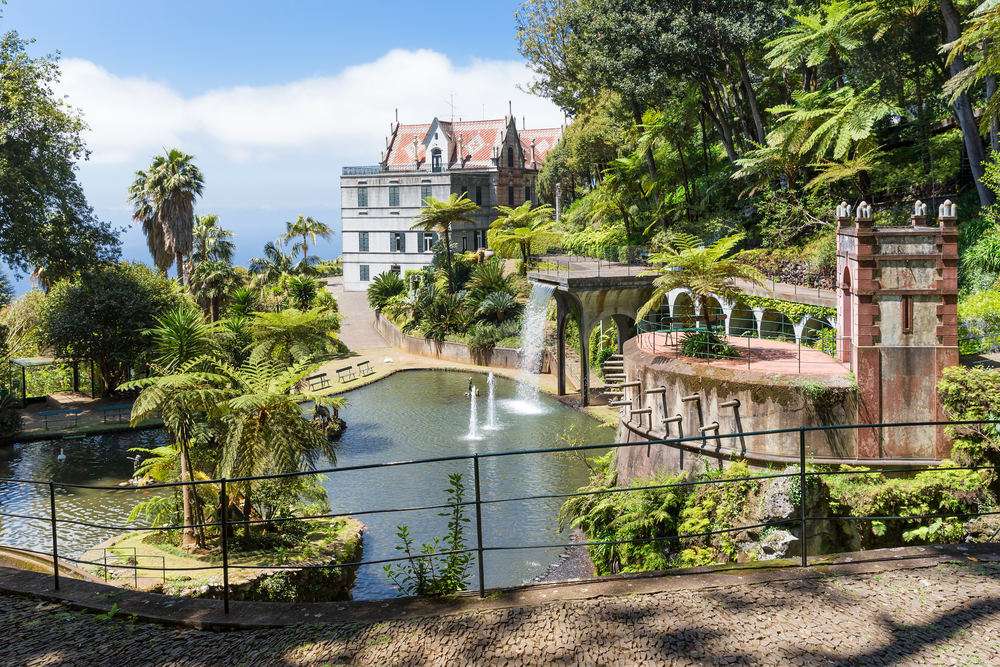 Tropical garden with pond and palace at Funchal,  Madeira island, Portugal