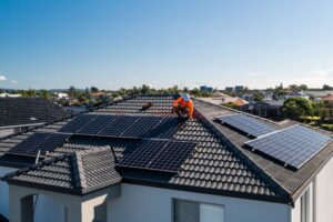 man installing solar panels on luxury house in Gauteng