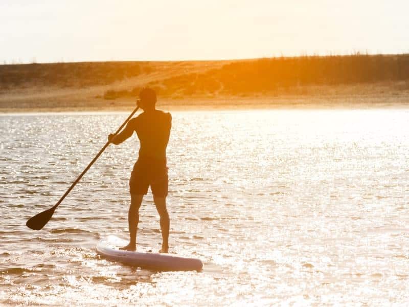 Man on paddleboard in the sunset