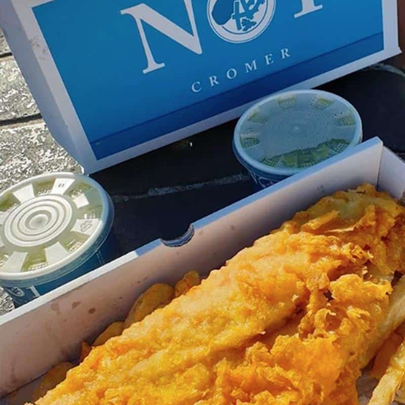 Battered cod and chips in a box