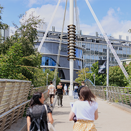 group of students walking towards Northumbria University city campus 