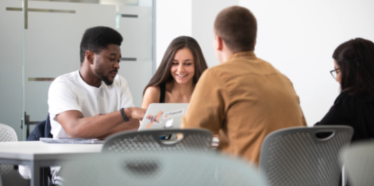 group of students sat around table