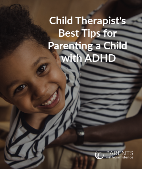 little boy being held by his dad and looking at camera with text overlay that reads: child therapist's best tips for parenting a child with ADHD