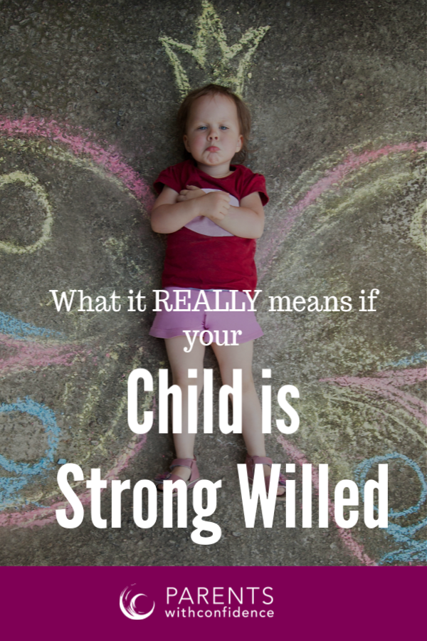 stubborn toddler lying on ground with text over her that reads: What it really means if your child is strong willed - for an article on strong-willed child characteristics