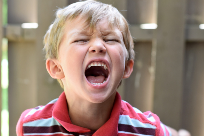 boy yelling in anger to illustrate a post on anger management activities for kids
