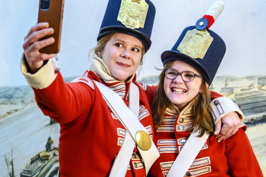 Visitors take selfies dressed as 1812-era soldiers at the Fortress Halifax: A City Shaped by Conflict exhibit at the Halifax Citadel National Historic Site, 2021