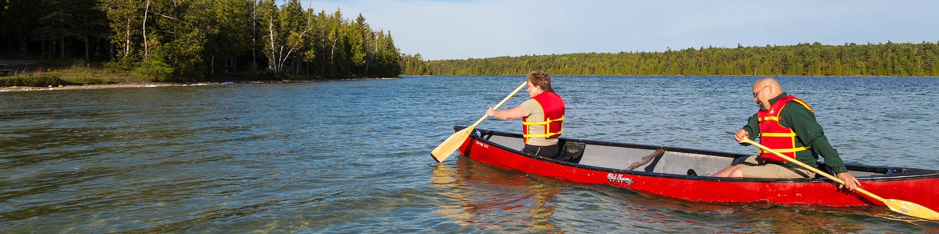 A family canoeing on a lake.