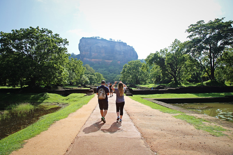 two people approaching the lion rock in Sigiriya, Sri Lanka