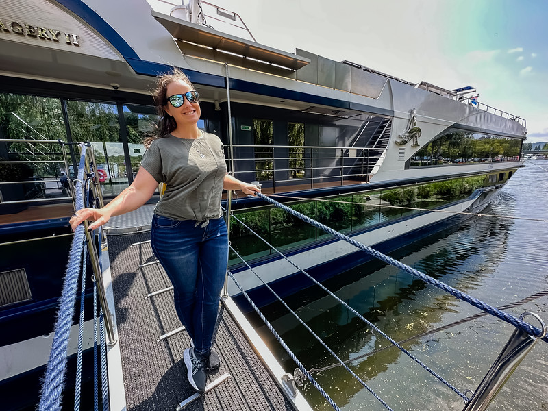 Lina Stock standing on the gangway of the Imagery II with Avalon Waterways in the Moselle Valley