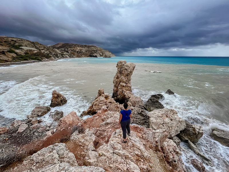 Lina Stock standing near Aphrodite's Rock in Cyprus