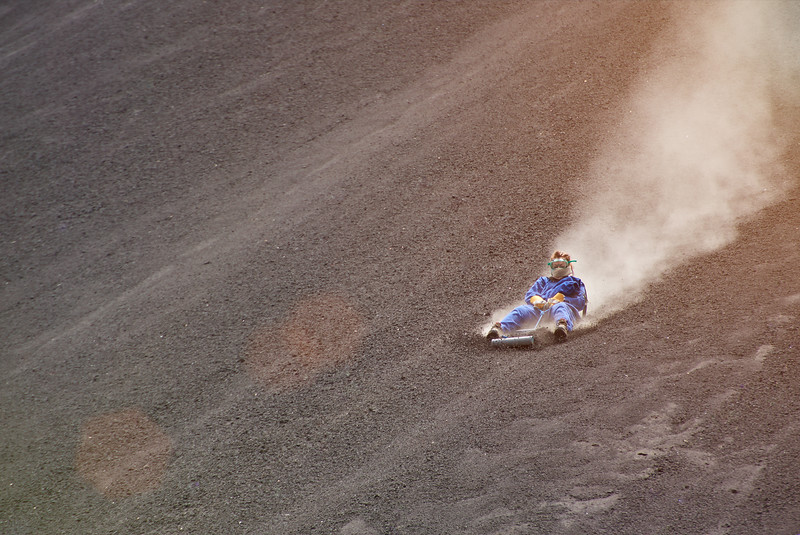 Volcano boarding activity in Nicaragua. Man in Cerro Negro volcano.