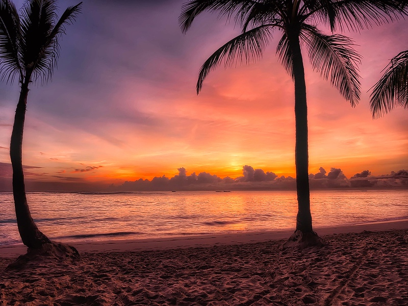 Sunset on a beach in Dominica - cheap islands to visit