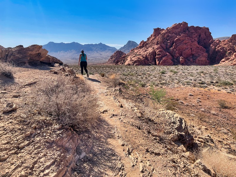 Lina Stock of Divergent Travelers Adventure Travel Blog hiking in Valley of Fire State Park in Nevada. 