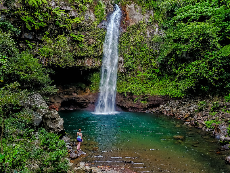 Lina Stock of Divergent Travelers Adventure Travel Blog exploring at waterfall on the island of Taveuni Fiji 