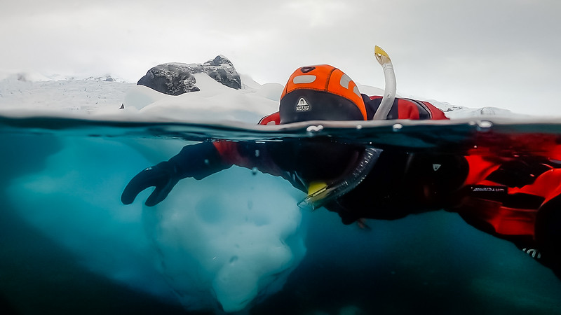 David Stock snorkeling with ice in Antarctica