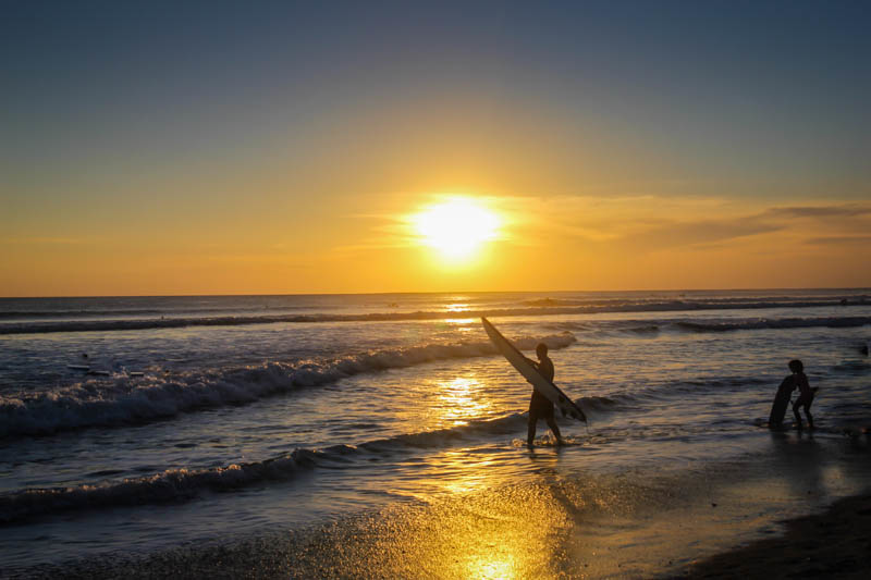 Sunset with surfers in Kuta Bali 