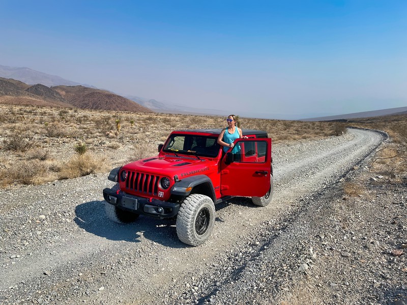Lina Stock of Divergent Travelers Adventure Travel Blog on the dirt track road to Racetrack Playa with a jeep rented through Farabee Jeep Rentals in Death Valley National Park. 
