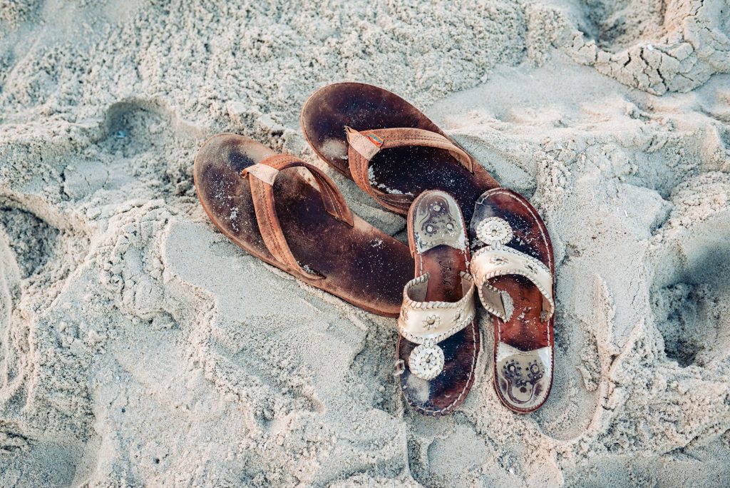 beach footwears of a couple during their beach engagement session