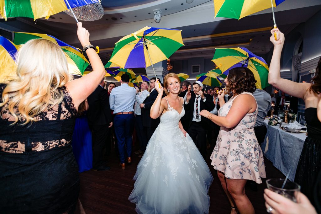 Bride dancing with umbrella at the Arts Ballroom