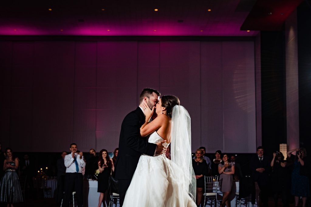 Bride kissing groom at the Loews Hotel in Philadelphia