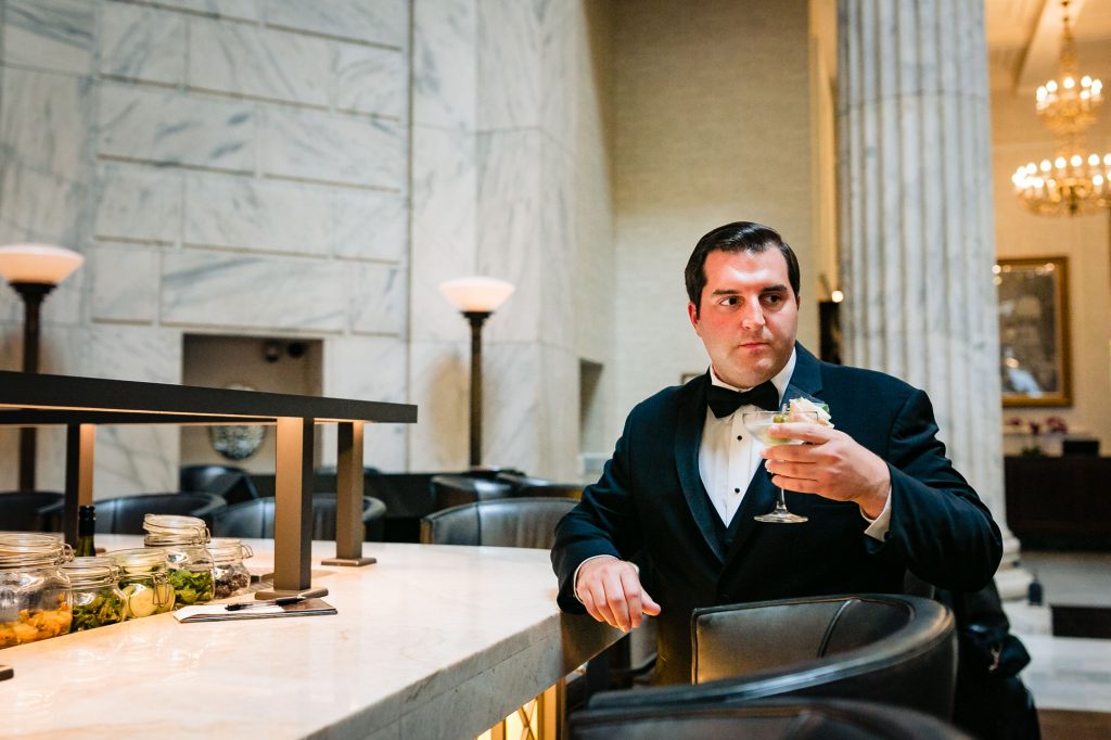 Groom drinking a martini at the Ritz Carlton Philadelphia