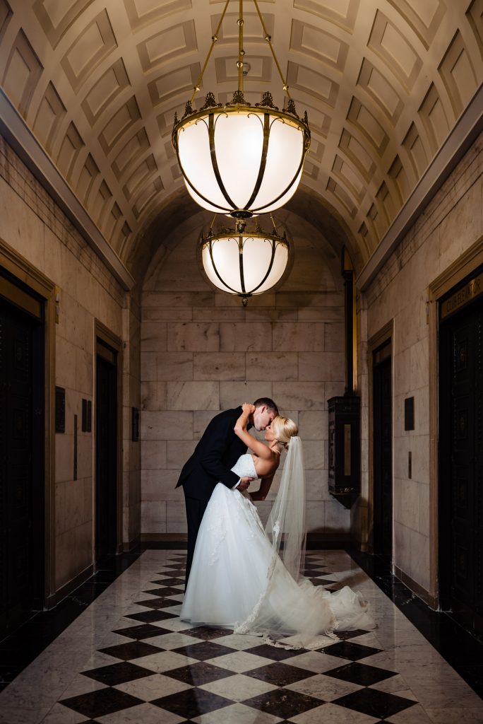 Bride and groom in epic wedding photo embracing at the Ritz Carlton Philadelphia