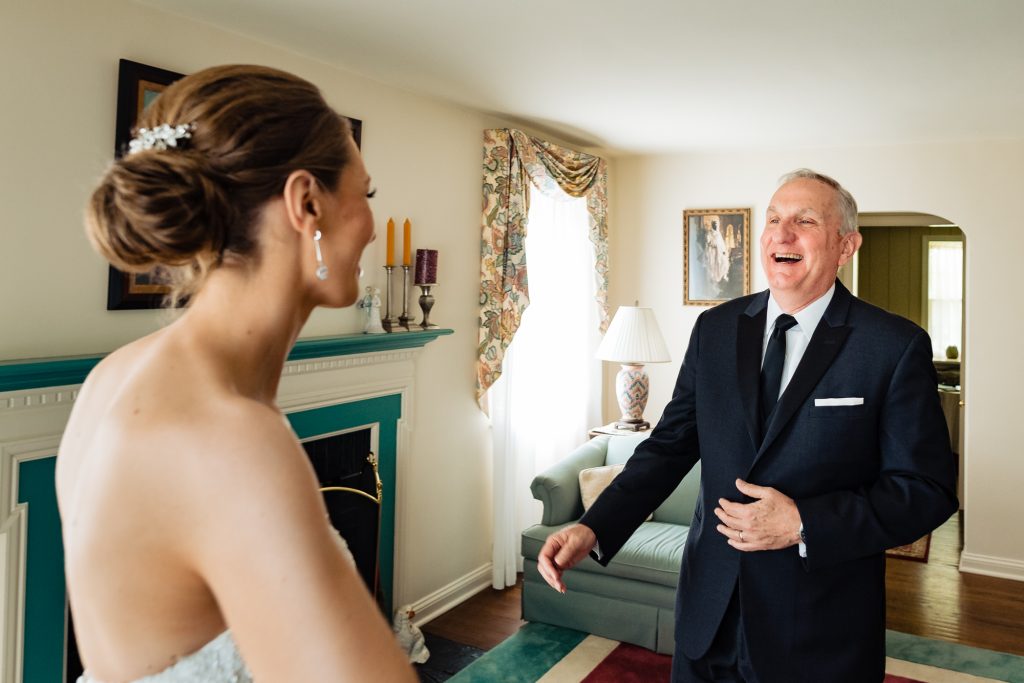 father of the bride smiling after seeing his daughter before her Hotel DuPont Wedding