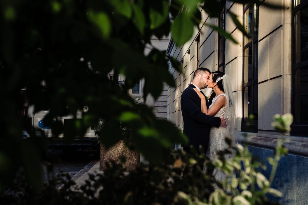bride and groom kissing before their Arts Ballroom Philadelphia wedding