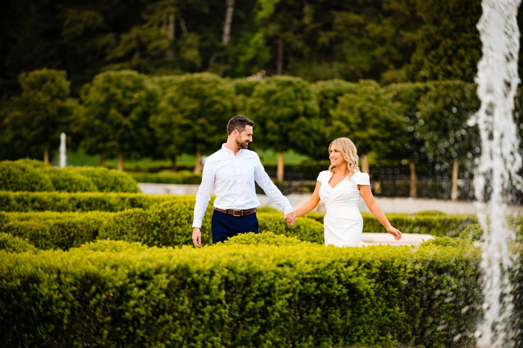 an engagement shoot taken at the classic European-inspired architecture and hand-carved Italianate limestone stonework and sculptures of the Main Fountain Garden area of longwood gardens