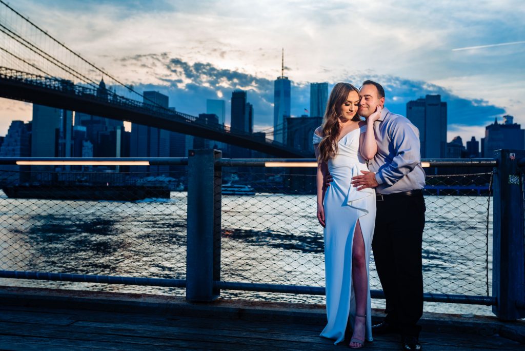 couple embracing at Brooklyn Bridge Park