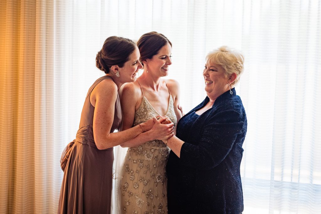 light moment between the bride and her bridal party