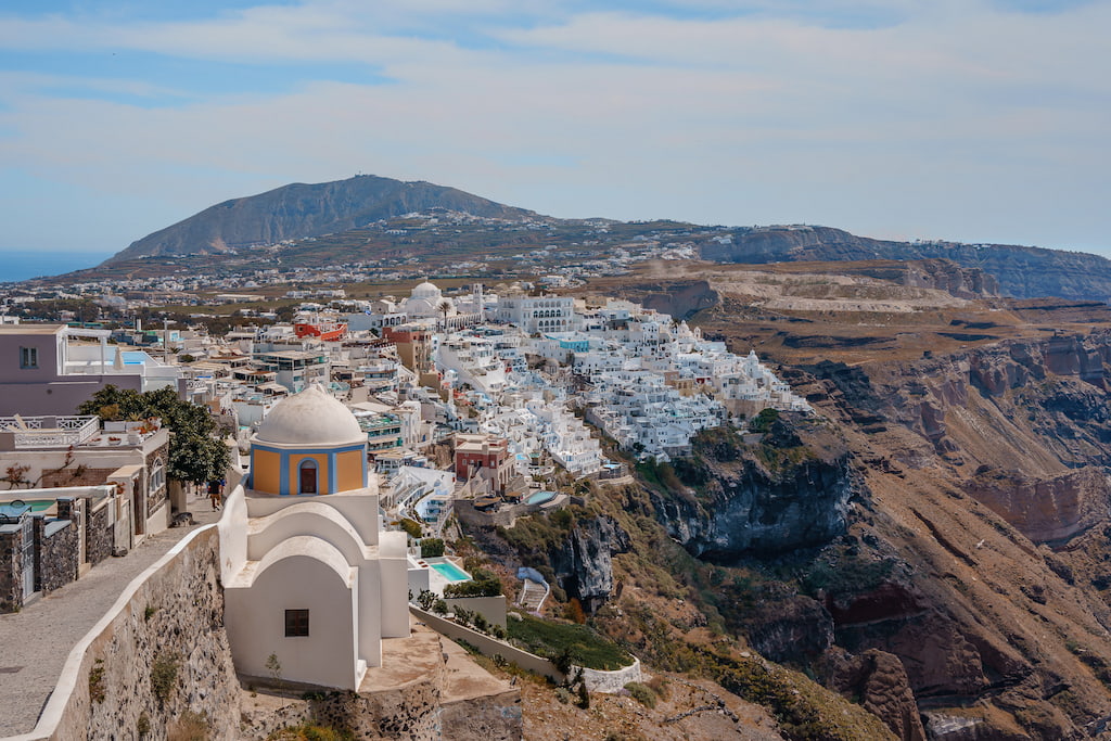 Panoramic view of Fira hotels with caldera view.