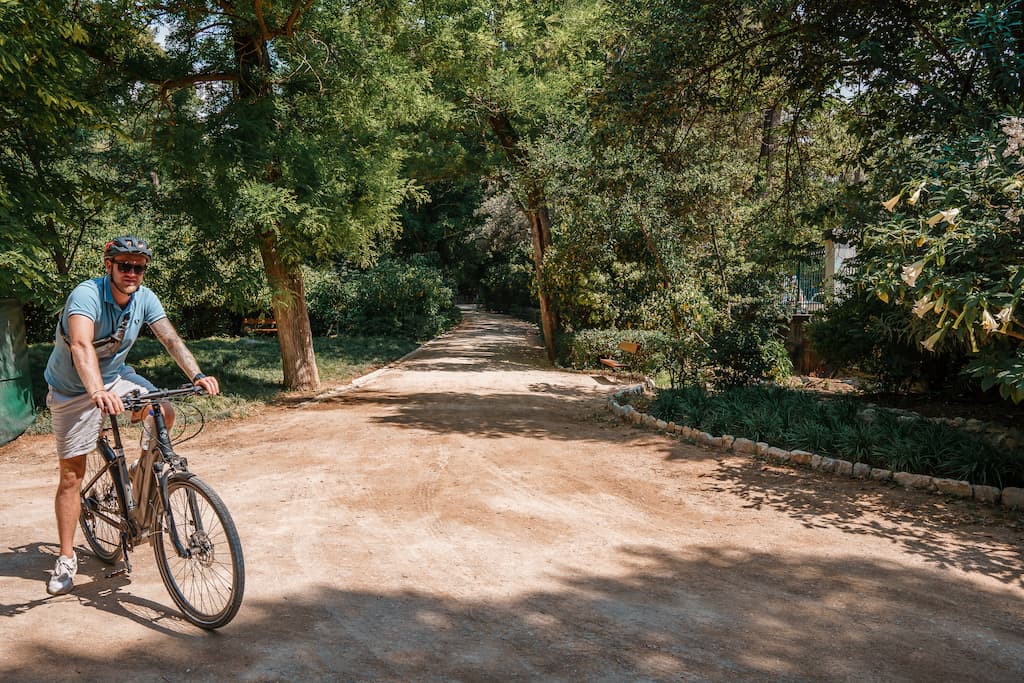 Cycling in Athens through the city gardens.