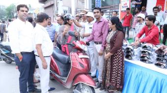 Road Safety Awareness & Helmet Distribution Camp for Ladies.