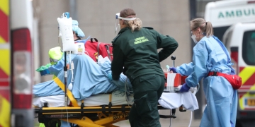 London's Ambulance treating a person infected with COVID-19