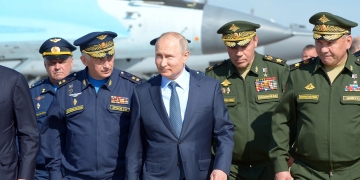 Russian President Vladimir Putin and Defense Minister Sergei Shoigu during the presentation of new military equipment