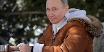 Russian President Vladimir Putin drinks tea in Siberian Taiga