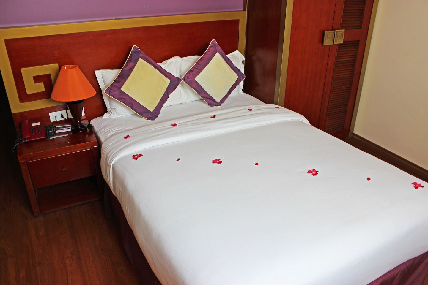 Our room at Aranya Hotel had even petals on the bed