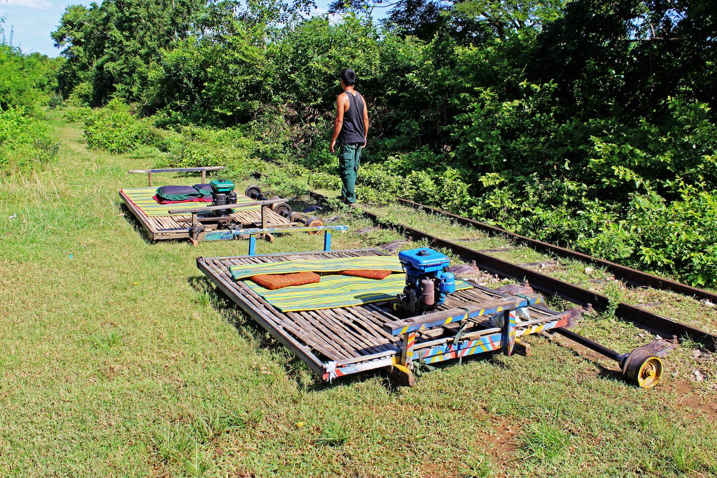Bamboo trains disassembled on the side of the track