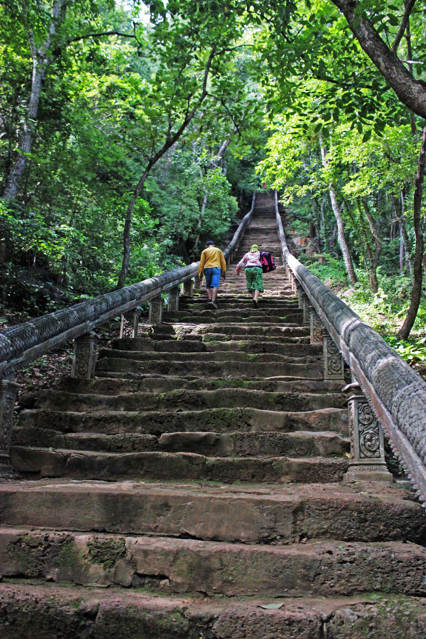 Climbing the stairs to Wat Banan