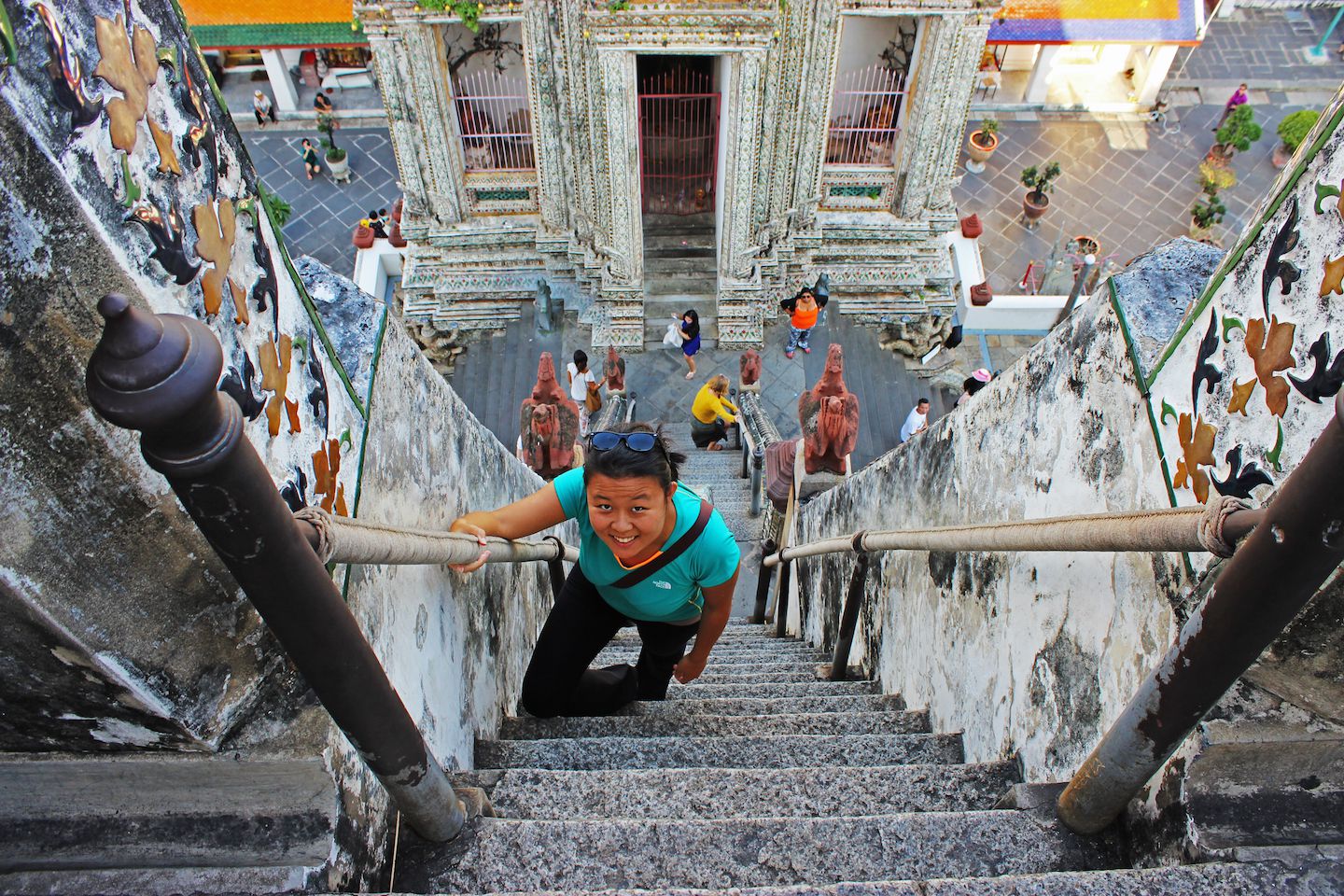 Julie climbing Wat Arun