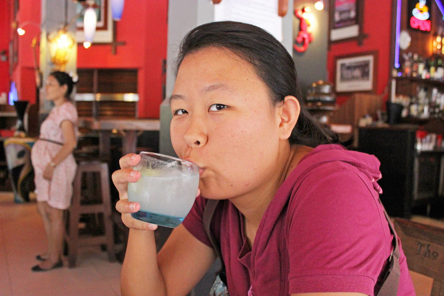 Julie drinking the Tomb Raider cocktail